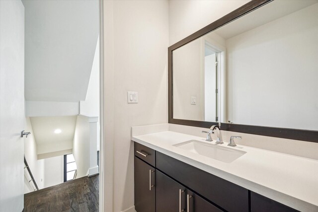 1704 Alamo St Unit A, Houston, TX 77007 - bathroom with wood finished floors, vanity, baseboards, and recessed lighting