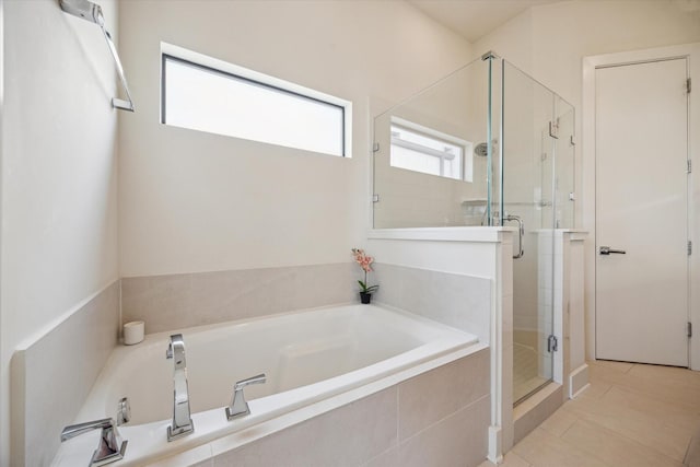 1704 Alamo St Unit A, Houston, TX 77007 - full bathroom featuring a stall shower, a bath, and tile patterned floors