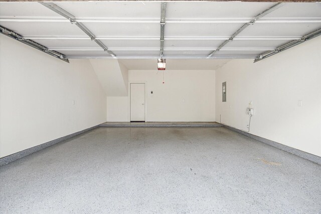 1704 Alamo St Unit A, Houston, TX 77007 - garage with a garage door opener, electric panel, and baseboards