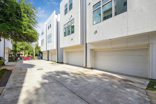 1704 Alamo St Unit A, Houston, TX 77007 - view of property with driveway and a garage