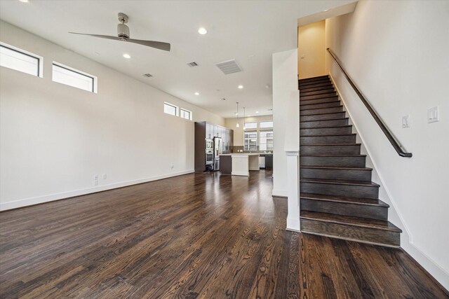 1704 Alamo St Unit A, Houston, TX 77007 - staircase with ceiling fan, wood finished floors, recessed lighting, and baseboards