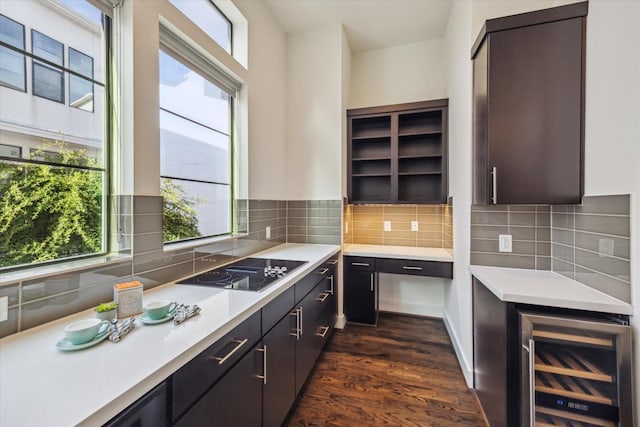1704 Alamo St Unit A, Houston, TX 77007 - kitchen featuring black electric cooktop, light countertops, wine cooler, and dark wood finished floors