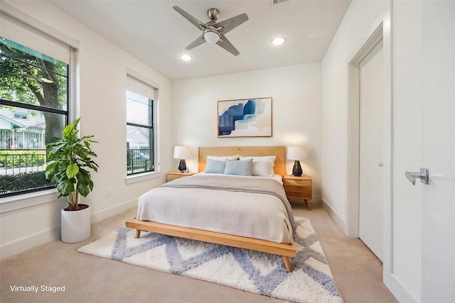 1704 Alamo St Unit A, Houston, TX 77007 - bedroom with light carpet, multiple windows, recessed lighting, baseboards, and a ceiling fan