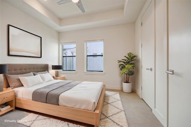 1704 Alamo St Unit A, Houston, TX 77007 - bedroom featuring light carpet, a raised ceiling, baseboards, and ceiling fan