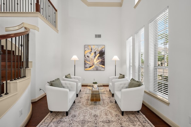 4603 Red Hawk Ct, Sugar Land, TX 77479 - living room with a towering ceiling, wood finished floors, crown molding, and stairway