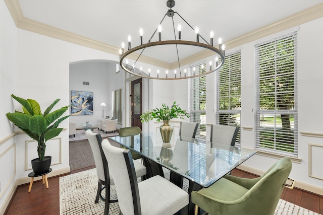 4603 Red Hawk Ct, Sugar Land, TX 77479 - dining room with a chandelier, ornamental molding, wood finished floors, and arched walkways