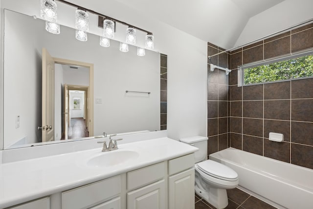 4603 Red Hawk Ct, Sugar Land, TX 77479 - bathroom featuring toilet, lofted ceiling, vanity, tile patterned floors, and bathing tub / shower combination