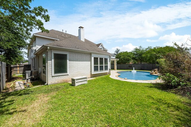4603 Red Hawk Ct, Sugar Land, TX 77479 - rear view of property with brick siding, a chimney, a shingled roof, and cooling unit