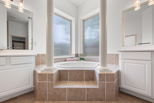 4603 Red Hawk Ct, Sugar Land, TX 77479 - full bath with healthy amount of natural light, tile patterned flooring, a garden tub, and vanity