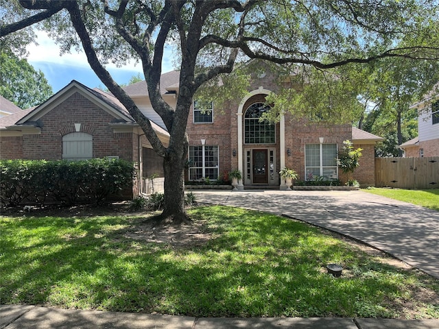 2103 Crescent Coral Dr, League City, TX 77573 - traditional home featuring brick siding and curved driveway