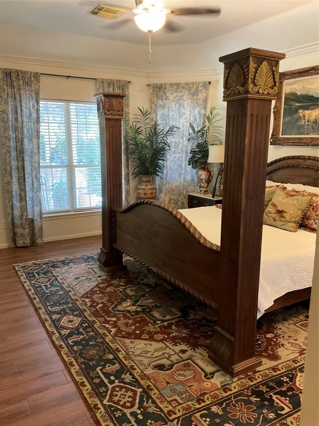 2103 Crescent Coral Dr, League City, TX 77573 - bedroom with dark wood finished floors, ceiling fan, and baseboards