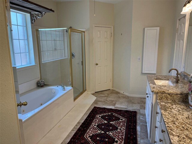 2103 Crescent Coral Dr, League City, TX 77573 - full bathroom with a stall shower, a tub with jets, vanity, and baseboards