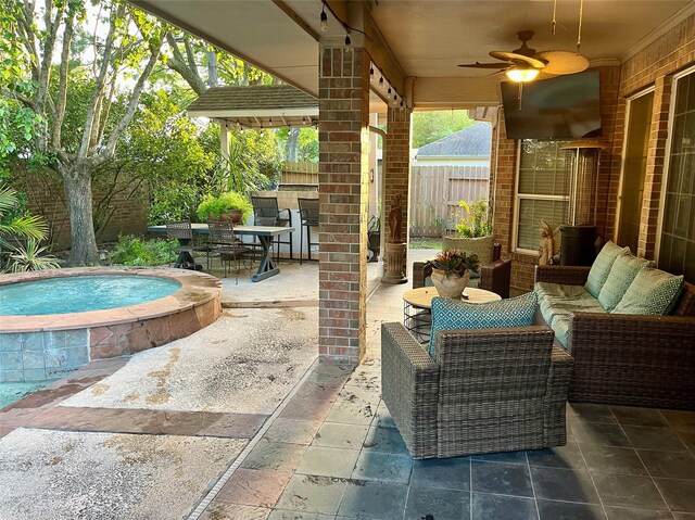 2103 Crescent Coral Dr, League City, TX 77573 - view of patio / terrace with an in-ground hot tub, a ceiling fan, and outdoor dining area