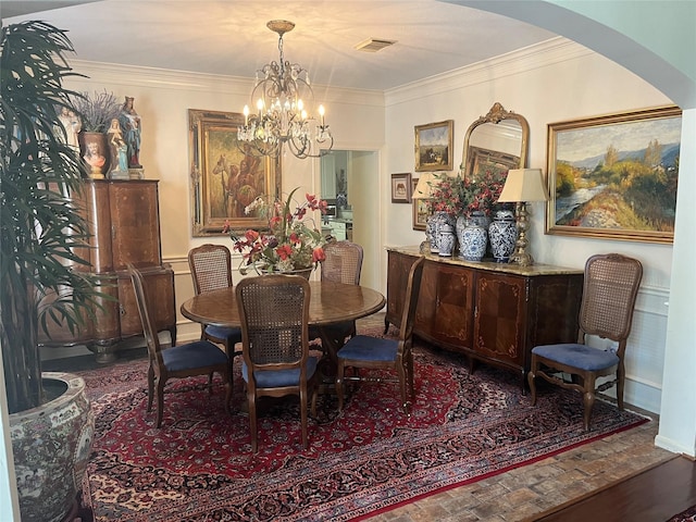 2103 Crescent Coral Dr, League City, TX 77573 - dining room with a chandelier, ornamental molding, and arched walkways
