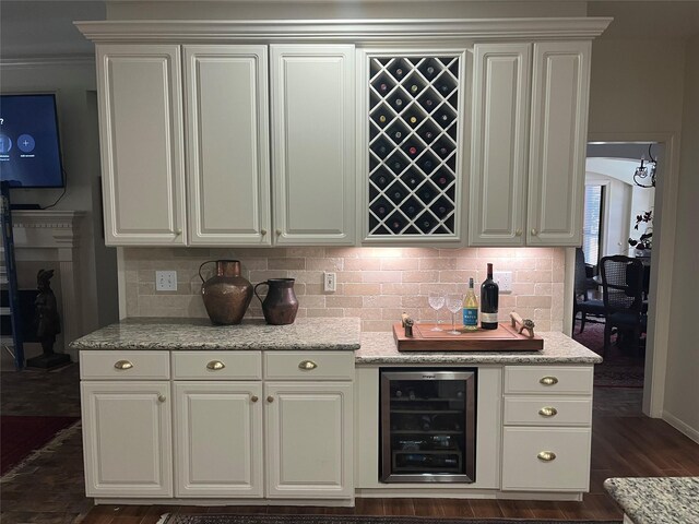 2103 Crescent Coral Dr, League City, TX 77573 - kitchen with beverage cooler, decorative backsplash, and light stone countertops