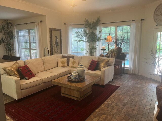 2103 Crescent Coral Dr, League City, TX 77573 - living area with brick floors, healthy amount of natural light, and crown molding