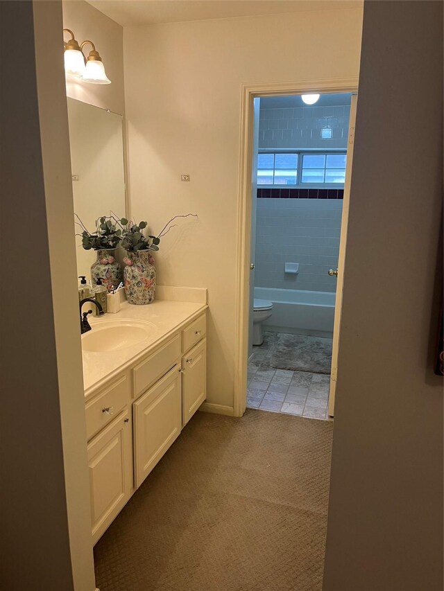 2103 Crescent Coral Dr, League City, TX 77573 - full bath featuring vanity, toilet, tile patterned flooring, baseboards, and shower / tub combination