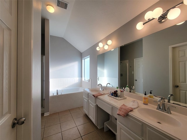 2310 Megellan Point Ln, Pearland, TX 77584 - full bath featuring tile patterned flooring, a bath, vaulted ceiling, double vanity, and a stall shower