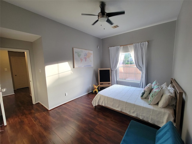 2310 Megellan Point Ln, Pearland, TX 77584 - bedroom with dark wood finished floors, baseboards, and ceiling fan