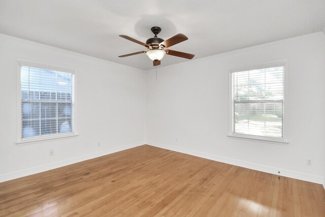 2606 Droxford Dr, Houston, TX 77008 - spare room with light wood-style flooring, crown molding, a ceiling fan, and baseboards