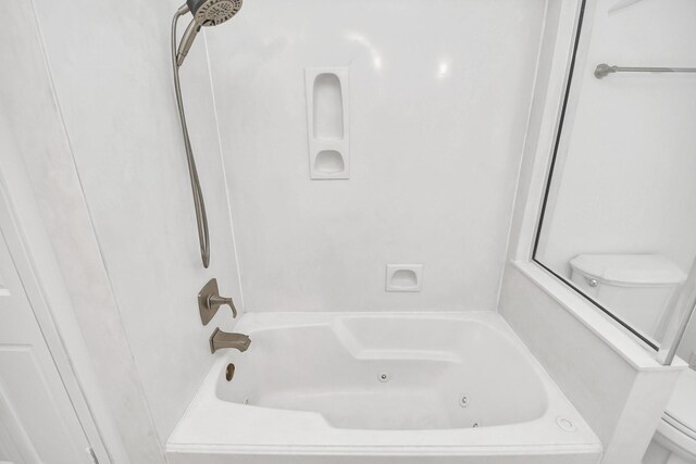 2606 Droxford Dr, Houston, TX 77008 - bathroom featuring toilet and a combined bath / shower with jetted tub