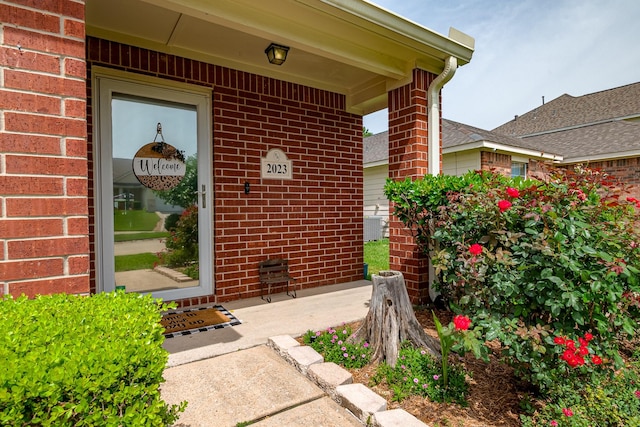 2023 Briar Grove Dr, Conroe, TX 77301 - entrance to property with brick siding and cooling unit