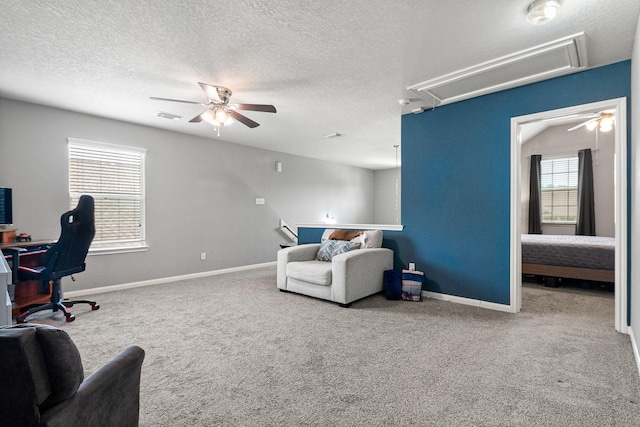 2023 Briar Grove Dr, Conroe, TX 77301 - office area featuring attic access, ceiling fan, carpet flooring, baseboards, and a textured ceiling