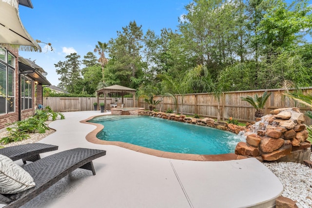 view of pool with a gazebo, a patio, a fenced backyard, and a pool with connected hot tub
