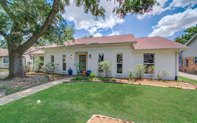 2514 Palo Pinto Dr, Houston, TX 77080 - ranch-style home featuring brick siding, a front lawn, and roof with shingles