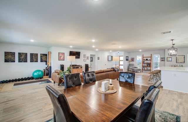 2514 Palo Pinto Dr, Houston, TX 77080 - dining area with light wood finished floors, recessed lighting, and a chandelier