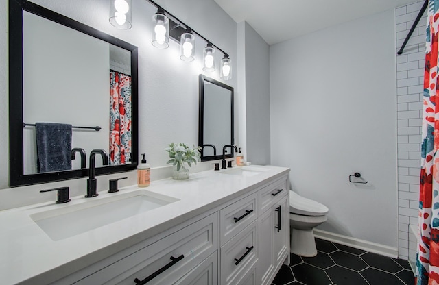 2514 Palo Pinto Dr, Houston, TX 77080 - full bath with toilet, tile patterned floors, double vanity, baseboards, and a shower with shower curtain