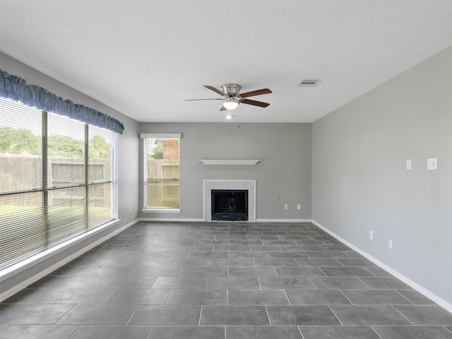 6123 Dove Fern Ct, Houston, TX 77041 - unfurnished living room featuring ceiling fan, a fireplace, and baseboards