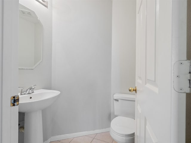 6123 Dove Fern Ct, Houston, TX 77041 - bathroom with baseboards, tile patterned floors, toilet, and a sink