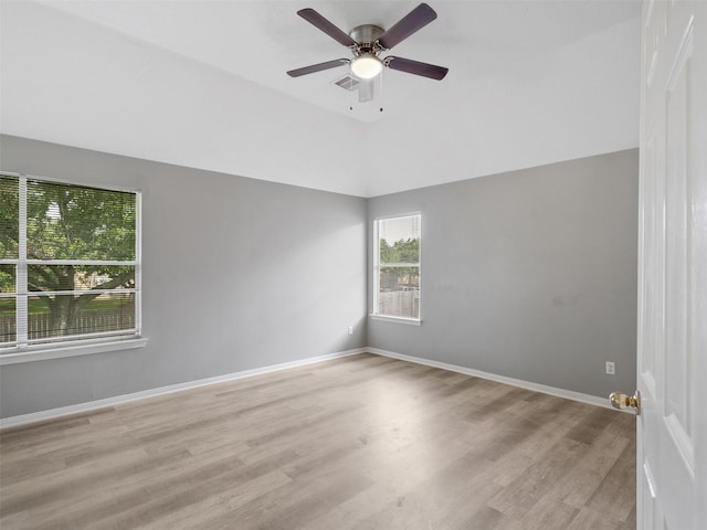 6123 Dove Fern Ct, Houston, TX 77041 - spare room with wood finished floors, ceiling fan, baseboards, and lofted ceiling