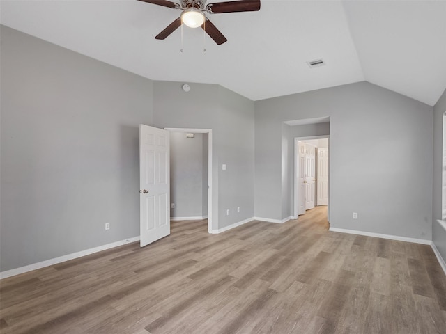 6123 Dove Fern Ct, Houston, TX 77041 - unfurnished bedroom with lofted ceiling, light wood-type flooring, baseboards, and ceiling fan