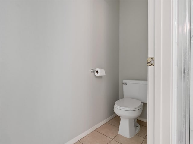 6123 Dove Fern Ct, Houston, TX 77041 - bathroom with tile patterned flooring, toilet, and baseboards
