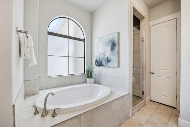 4404 Dickson St Unit B, Houston, TX 77007 - full bathroom featuring healthy amount of natural light, a shower stall, a bath, and tile patterned flooring