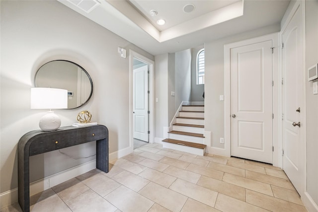 4404 Dickson St Unit B, Houston, TX 77007 - foyer entrance featuring baseboards, stairway, light tile patterned floors, a tray ceiling, and recessed lighting
