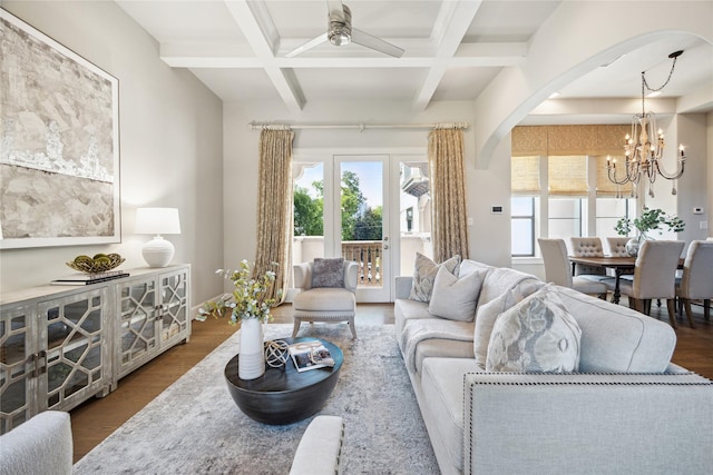 4404 Dickson St Unit B, Houston, TX 77007 - living area with arched walkways, plenty of natural light, coffered ceiling, a chandelier, and wood finished floors