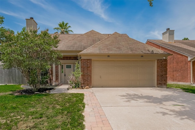 9911 Villa Verde Dr, Houston, TX 77064 - view of front of home featuring an attached garage, brick siding, driveway, a chimney, and roof with shingles