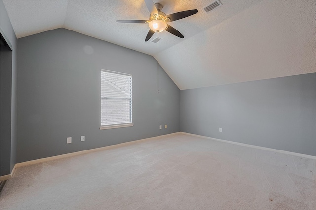 9911 Villa Verde Dr, Houston, TX 77064 - bonus room featuring lofted ceiling, a ceiling fan, light carpet, a textured ceiling, and baseboards