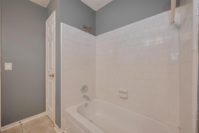 9911 Villa Verde Dr, Houston, TX 77064 - full bath featuring tile patterned floors, a textured ceiling, shower / washtub combination, and baseboards