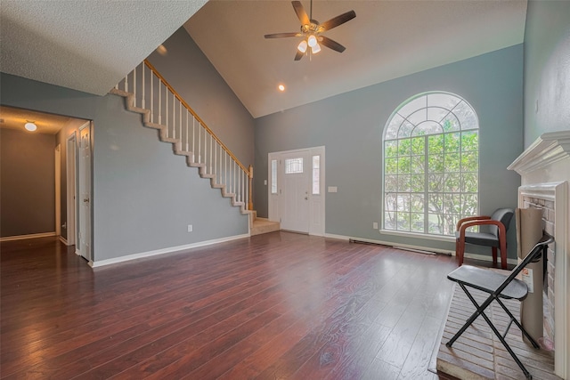 9911 Villa Verde Dr, Houston, TX 77064 - entryway with stairway, a ceiling fan, wood finished floors, high vaulted ceiling, and baseboards