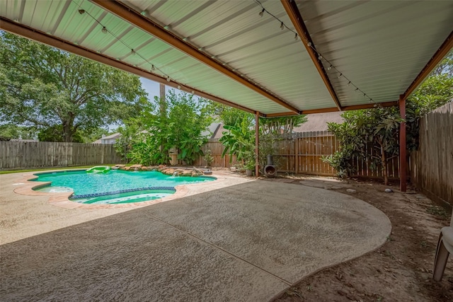 9911 Villa Verde Dr, Houston, TX 77064 - view of swimming pool with a patio, a fenced backyard, and a pool with connected hot tub
