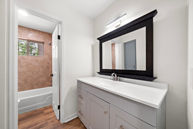 52 S High Oaks Cir, The Woodlands, TX 77380 - bathroom with wood finished floors, vanity, shower / bath combination, and baseboards