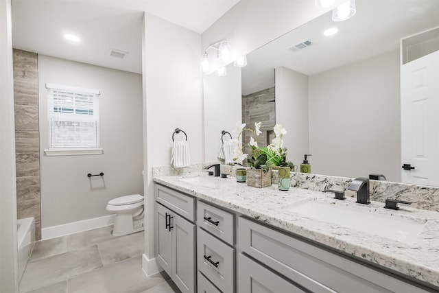 bathroom with toilet, double vanity, baseboards, tile patterned floors, and recessed lighting