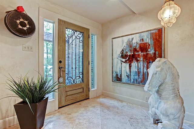 entryway featuring baseboards
