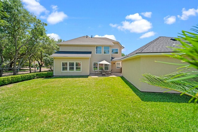 20002 Meadow Arbor Ct, Katy, TX 77450 - rear view of house featuring a patio and stucco siding