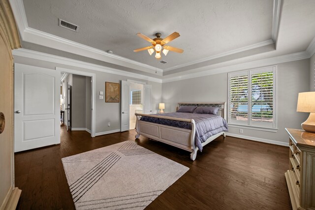 20002 Meadow Arbor Ct, Katy, TX 77450 - bedroom featuring a tray ceiling, dark wood-type flooring, baseboards, ornamental molding, and ceiling fan