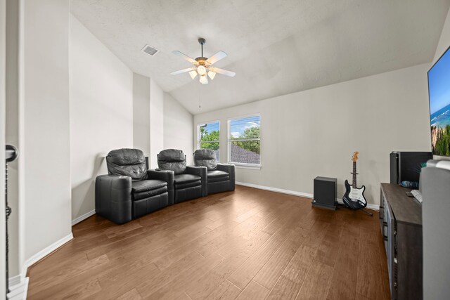 20002 Meadow Arbor Ct, Katy, TX 77450 - home theater room with ceiling fan, wood finished floors, vaulted ceiling, and baseboards